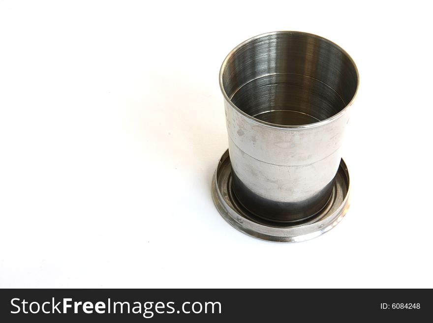 Stainless steel beaker isolated on white