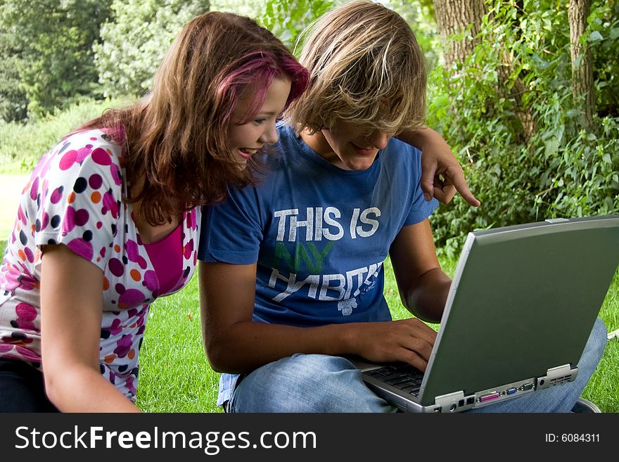 Students studying in a park in the summertime. Students studying in a park in the summertime