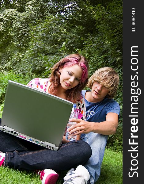 Students studying in a park in the summertime. Students studying in a park in the summertime