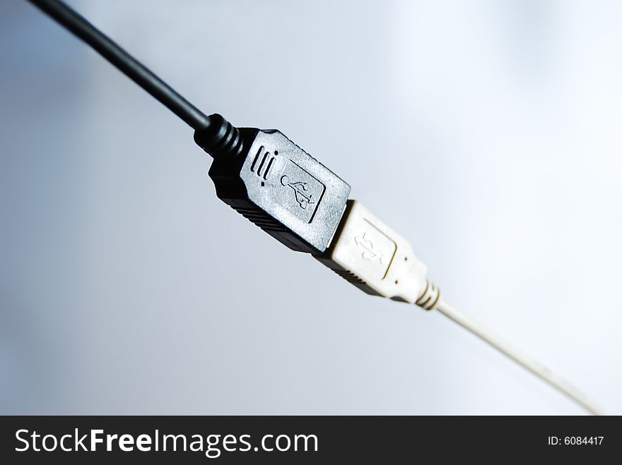 Black and white USB cables, are connected among themselves