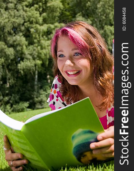 Students studying in a park in the summertime. Students studying in a park in the summertime