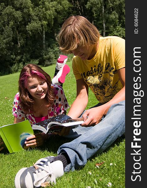 Students studying in a park in the summertime. Students studying in a park in the summertime