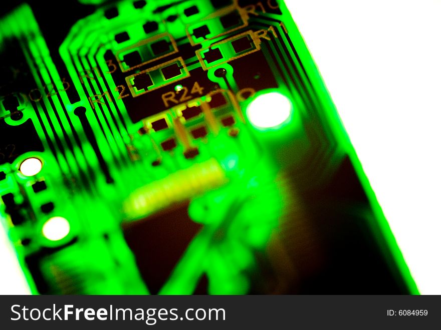 A small piece of printed circuit board over a bright lamp