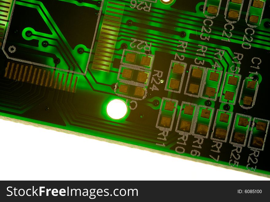 A small piece of printed circuit board over a bright lamp