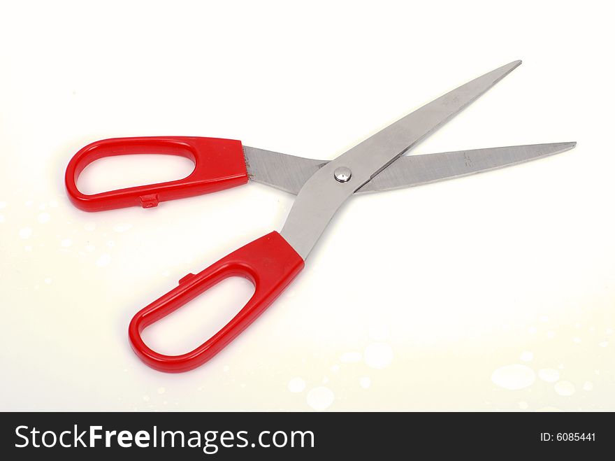 A pair of scissors on white background