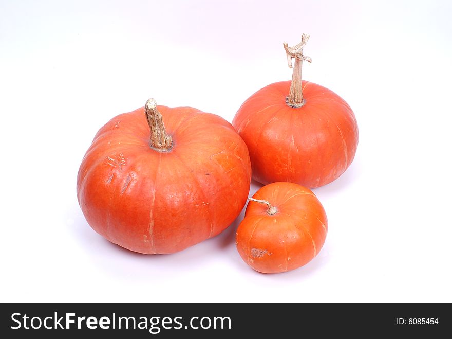 Three pumpkins on white background.