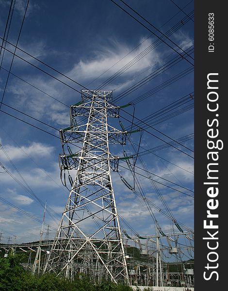 An electricity power pylon stretches into the sky. An electricity power pylon stretches into the sky