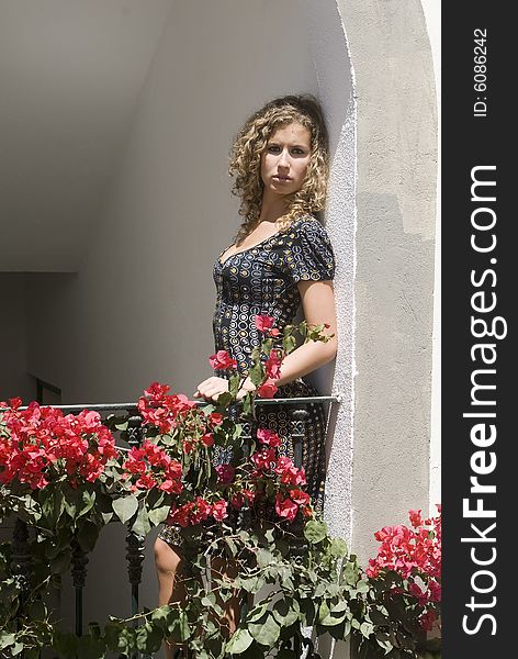 Beautiful Girl Waiting In An Spanish Balcony