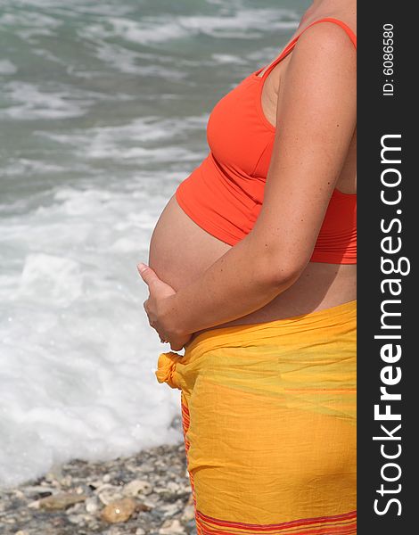 Pregnant woman at sea shore. Pregnant woman at sea shore