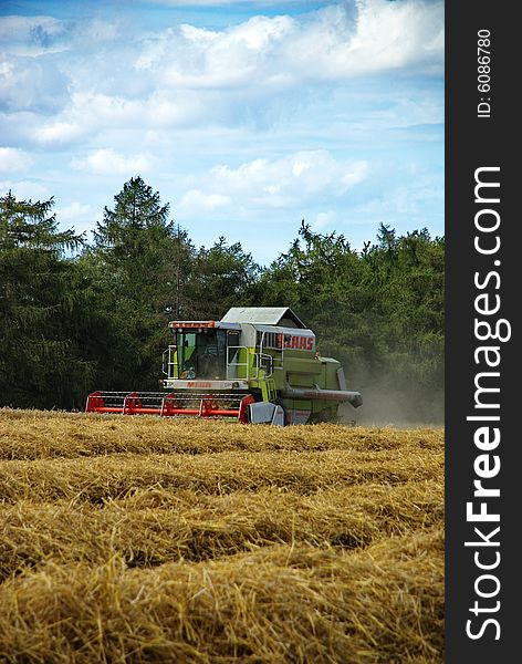 A harvester doing its job in the late summer. Czech Republic, August 2008. A harvester doing its job in the late summer. Czech Republic, August 2008.