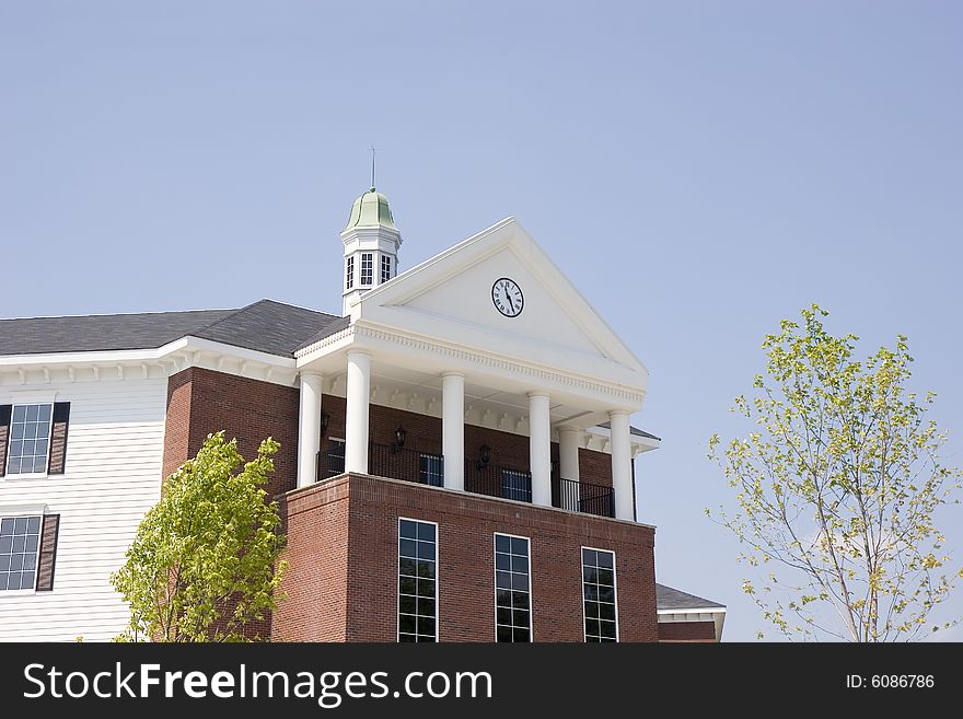 A nice commercial building of brick and siding with a clock and cupola. A nice commercial building of brick and siding with a clock and cupola