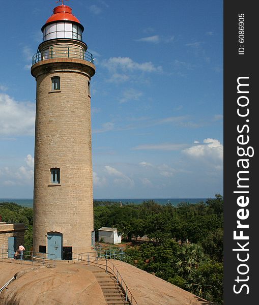 Light house with sea and sky at background