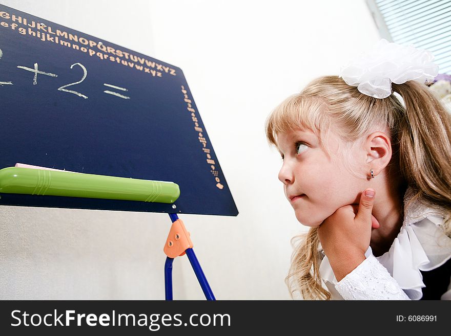 An image of nice little girl in shool. An image of nice little girl in shool.