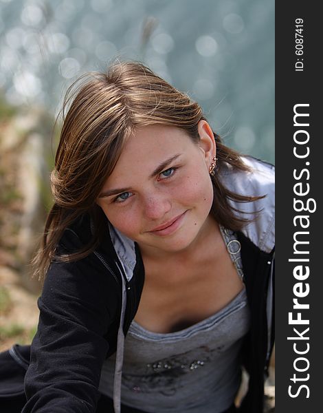 Teenager on rocky coast of the lake. Teenager on rocky coast of the lake