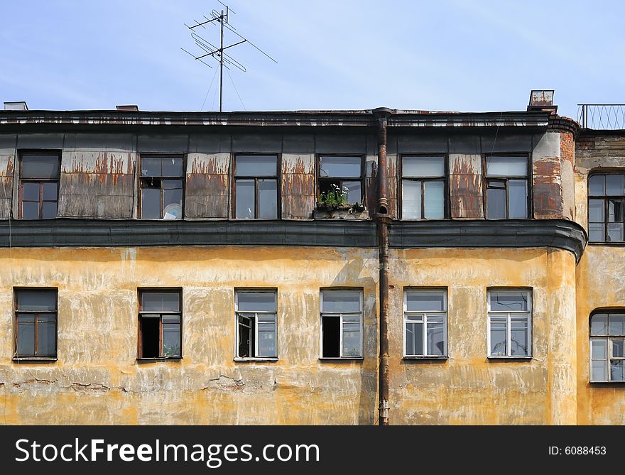 Old house with the peeled off paint