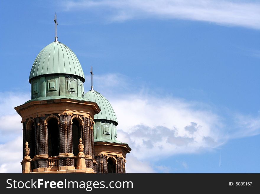Top of a church with a blue sunny background