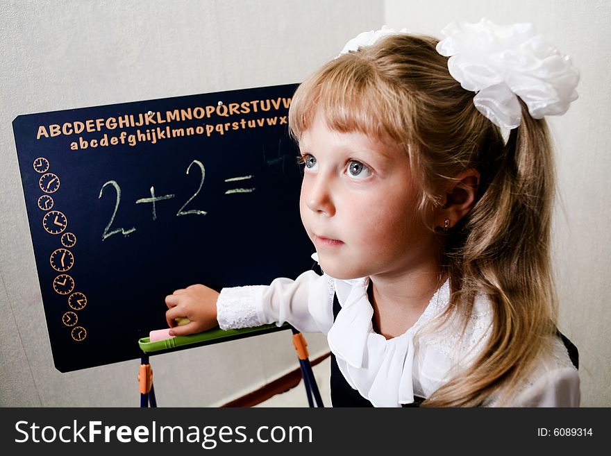 An image of nice little girl in classroom.