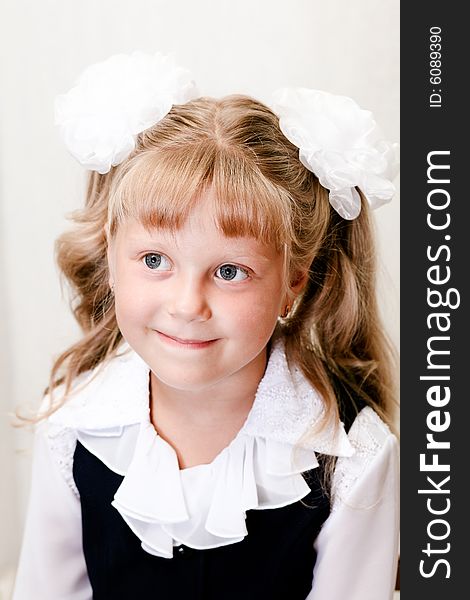 An image of little girl with white bow. An image of little girl with white bow