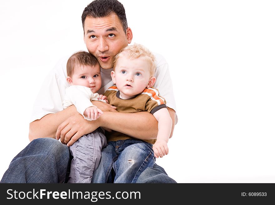 Cute brother and sister from different races having fun with daddy. Cute brother and sister from different races having fun with daddy