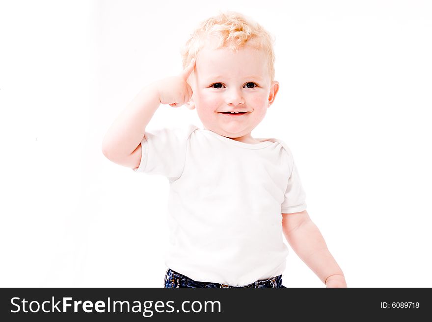 Cute Caucasian blond toddler is happy and playful. Cute Caucasian blond toddler is happy and playful