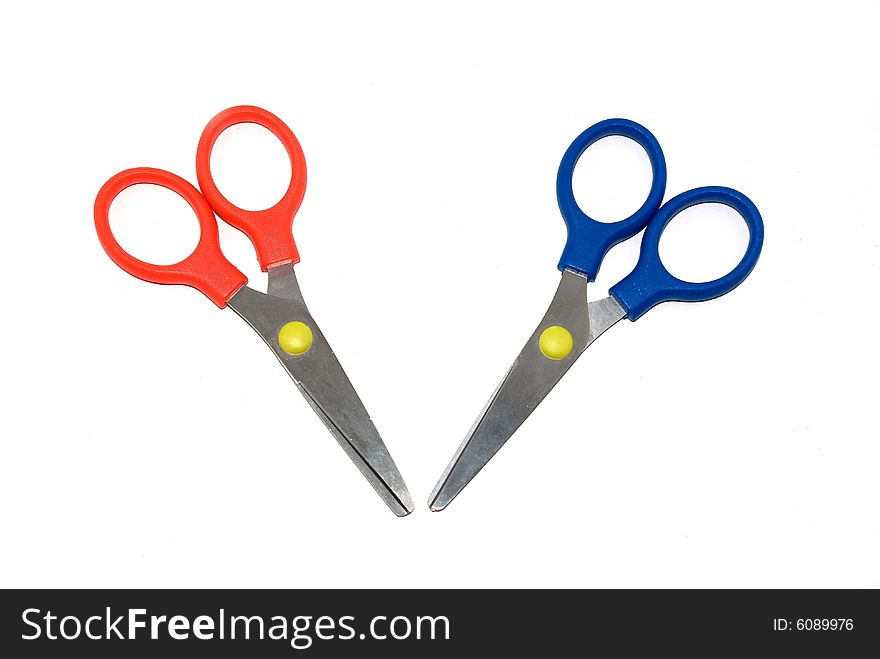 Red and dark blue scissors isolated on a white background