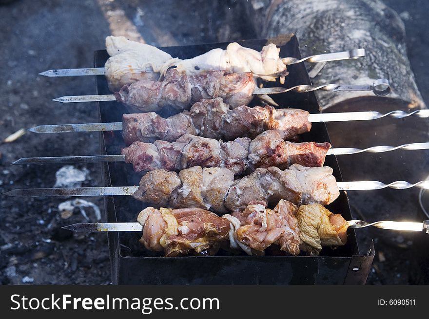 Meat kebabs on a grill