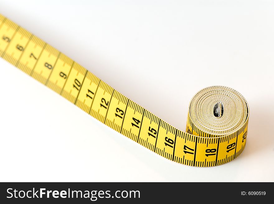 Measuring tape details over a white background