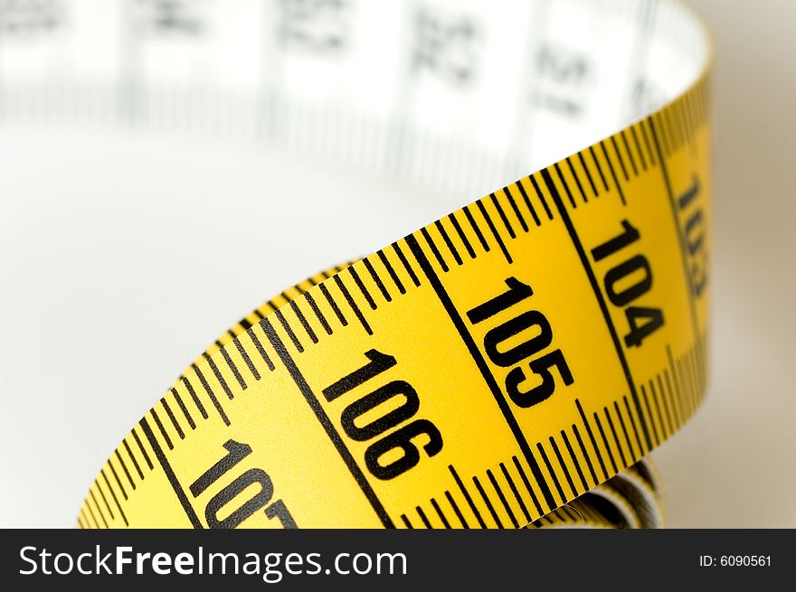 Measuring tape details over a white background