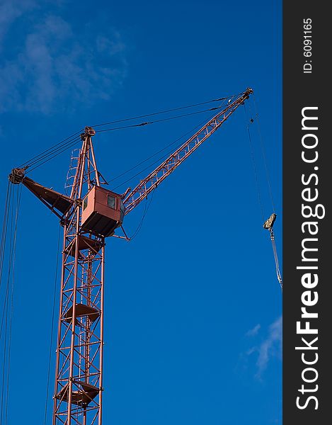 Photo of a tower crane on sky background