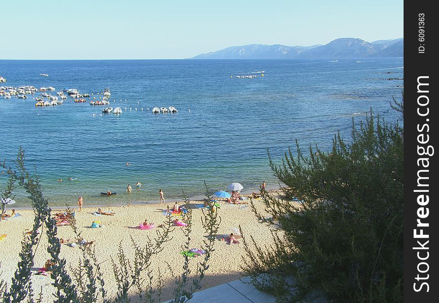 Cala Gonone town beach on Sardinia, Italy (Spiaggia Centrale). Cala Gonone town beach on Sardinia, Italy (Spiaggia Centrale)