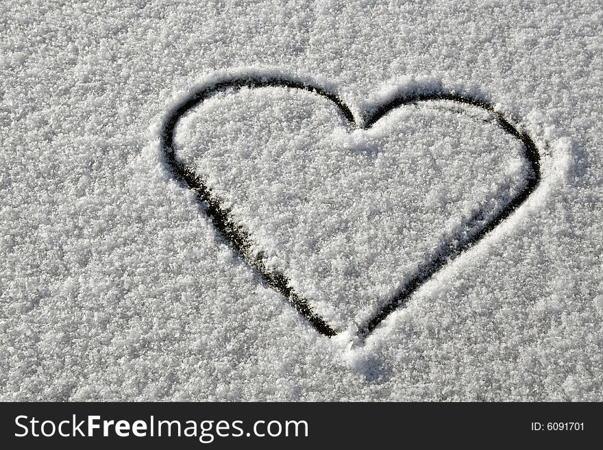 Heart drawn on fresh snow. Heart drawn on fresh snow