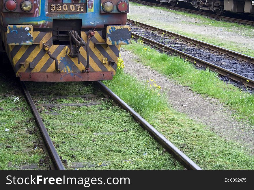 Detail of an old-fashioned train on a railway. Detail of an old-fashioned train on a railway