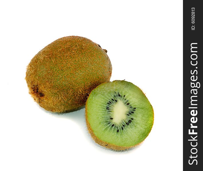 Whole and cut ripe, juicy kiwi on a white background.