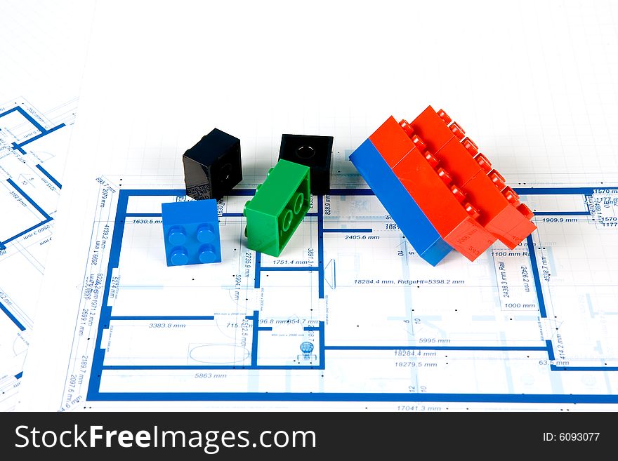 Blueprint For A House And Plastic Blocks