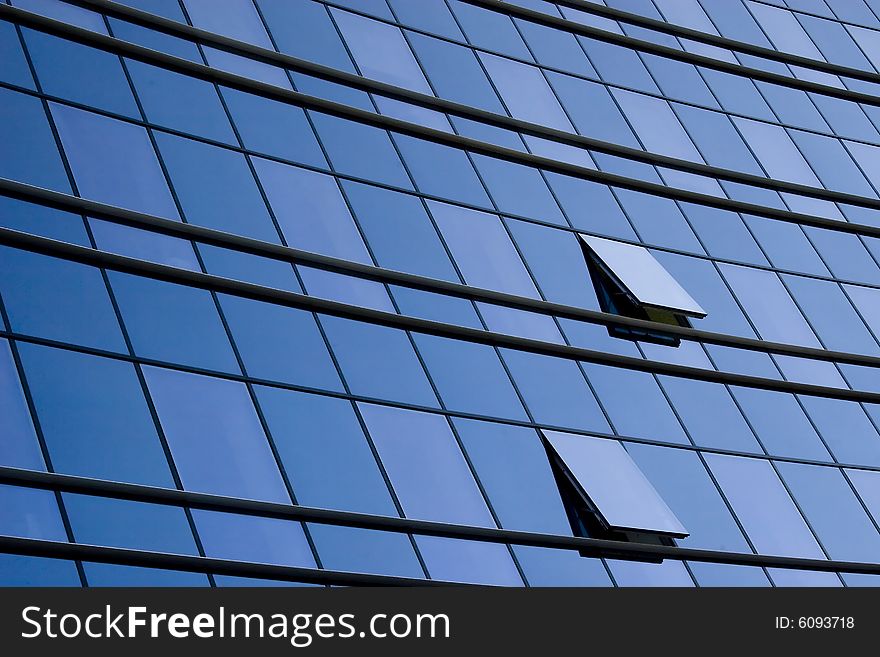 Modern office building glass wall and two windows