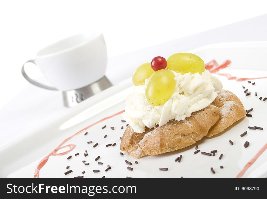 Sweet cookie with cream on plate