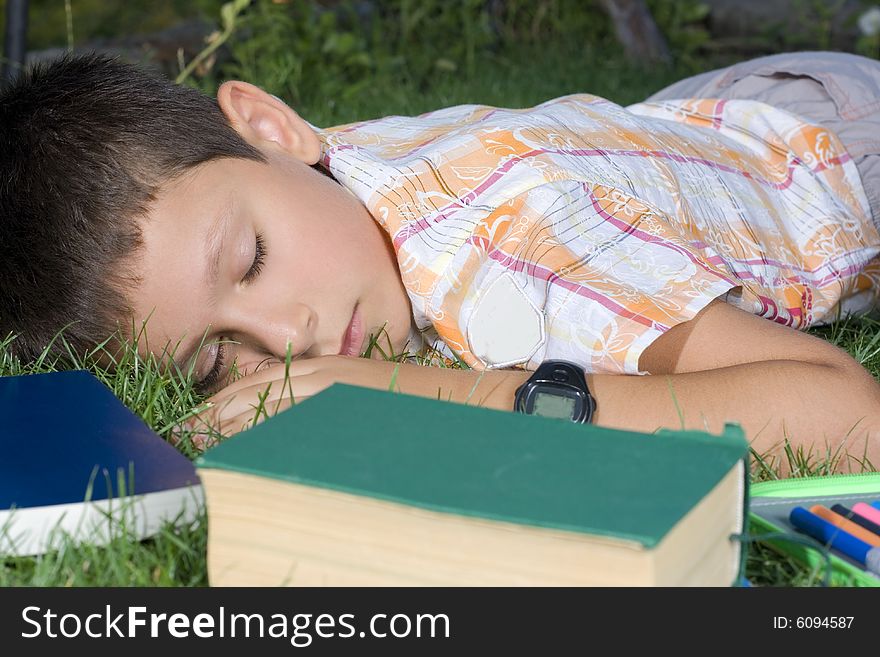 The sleeping student with books outdoors