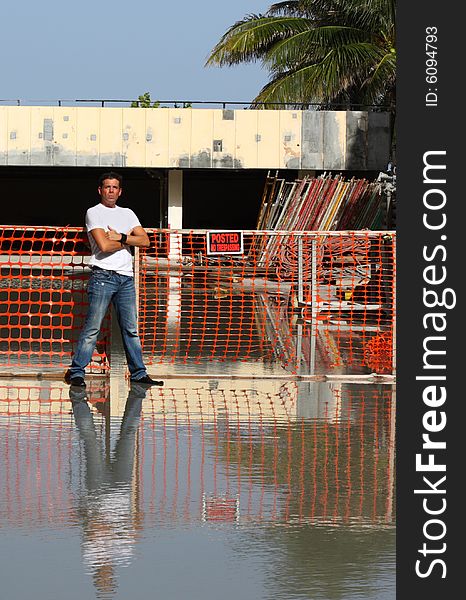 Man standing by a construction zone. Man standing by a construction zone.