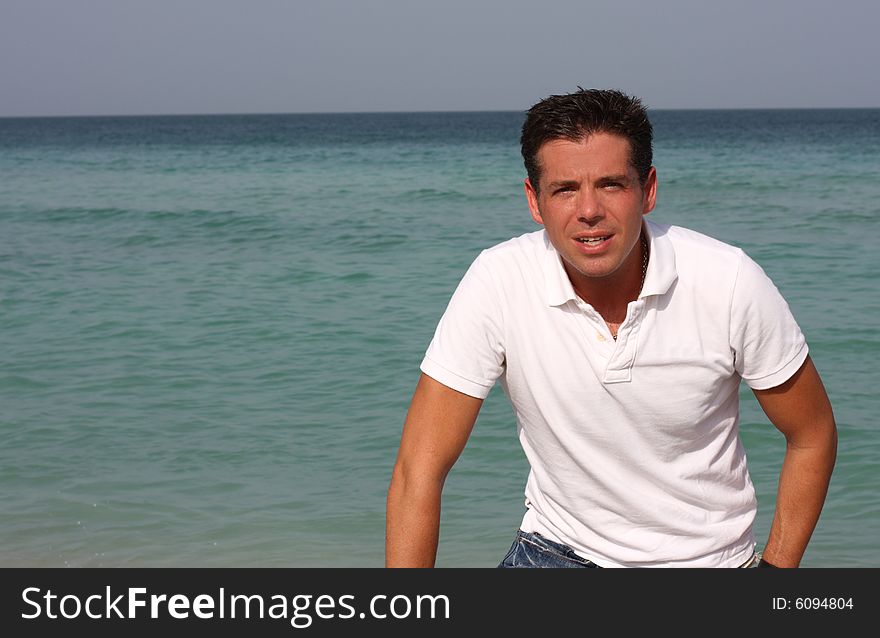 Man with the horizon of the ocean in the background. Man with the horizon of the ocean in the background.