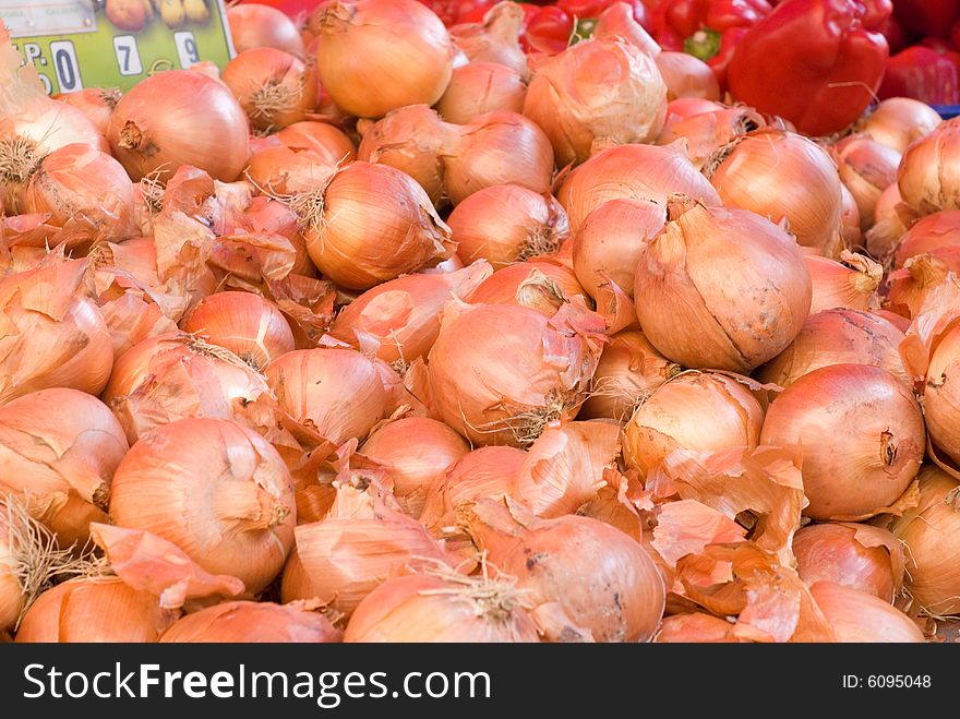 A lot of onions in a street market