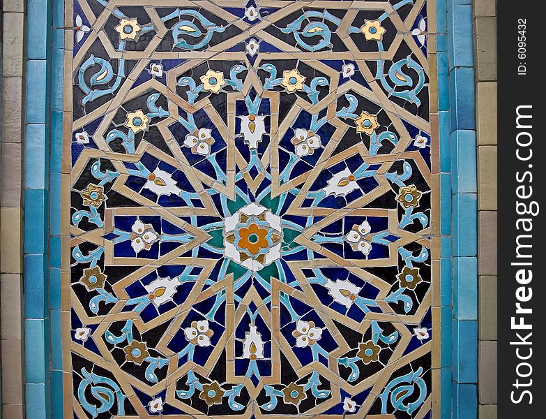 Glazed tile ornamental pattern on the mosque`s wall. Glazed tile ornamental pattern on the mosque`s wall
