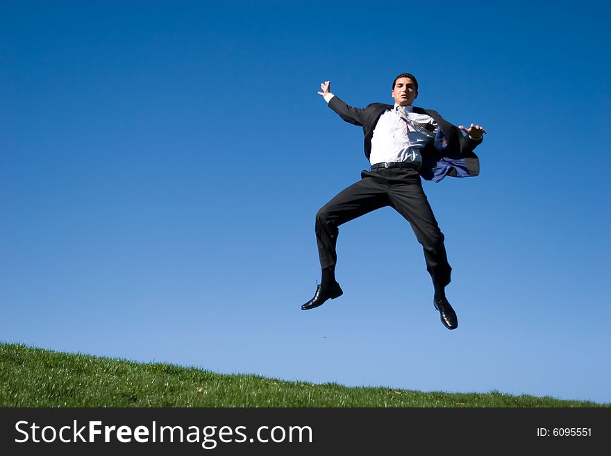 Businessman jumping in the air