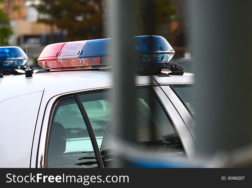 Side view of a police siren thru gate. Side view of a police siren thru gate