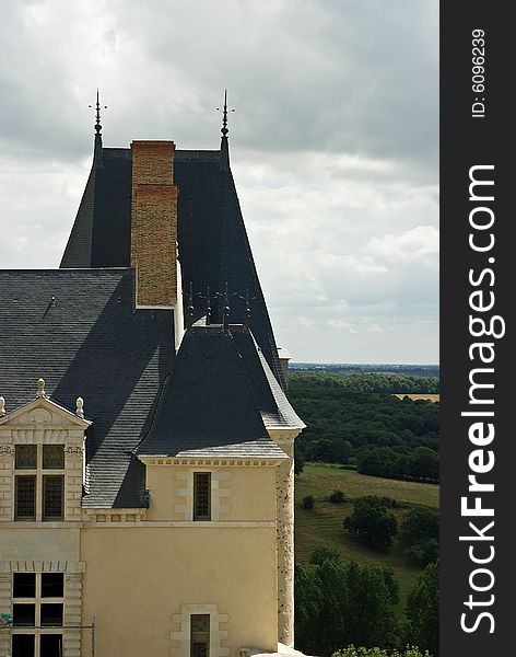 A French castle tower seen against moody skies. A French castle tower seen against moody skies