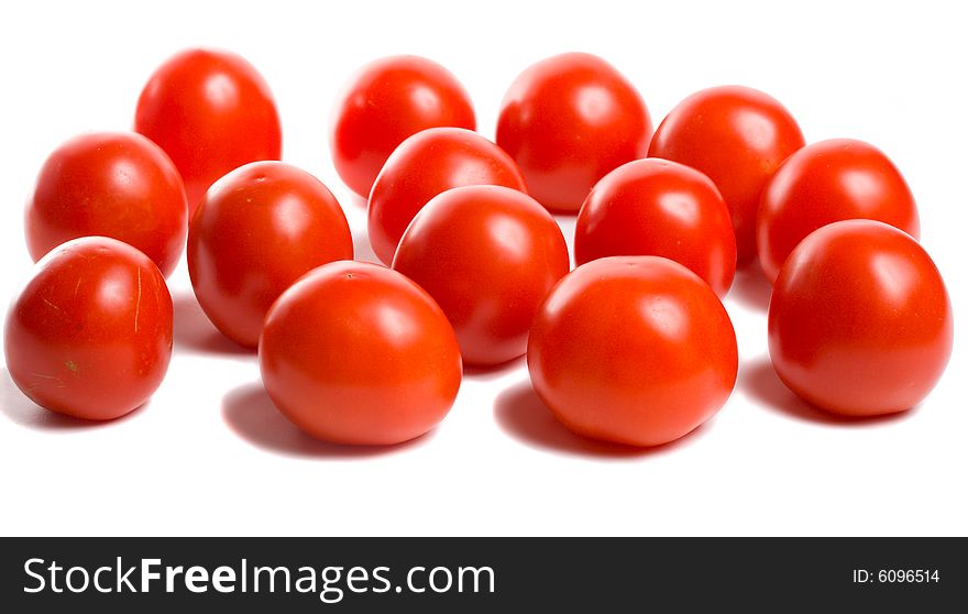 Close-up many ripe tomatoes, isolated on white