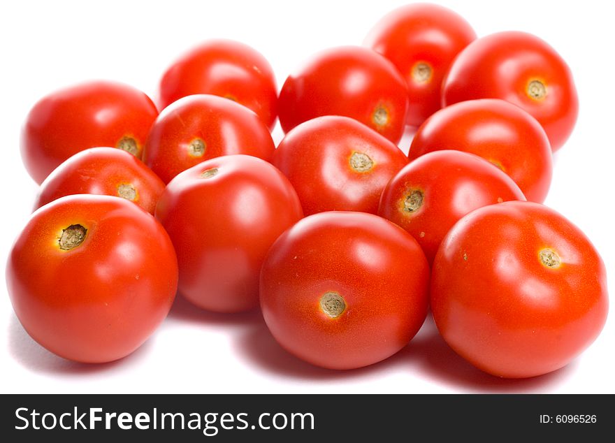 Close-up many tomatoes, isolated on white