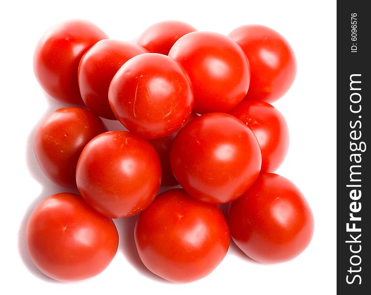 Close-up tomatoes in pyramid, view from above, isolated on white. Close-up tomatoes in pyramid, view from above, isolated on white