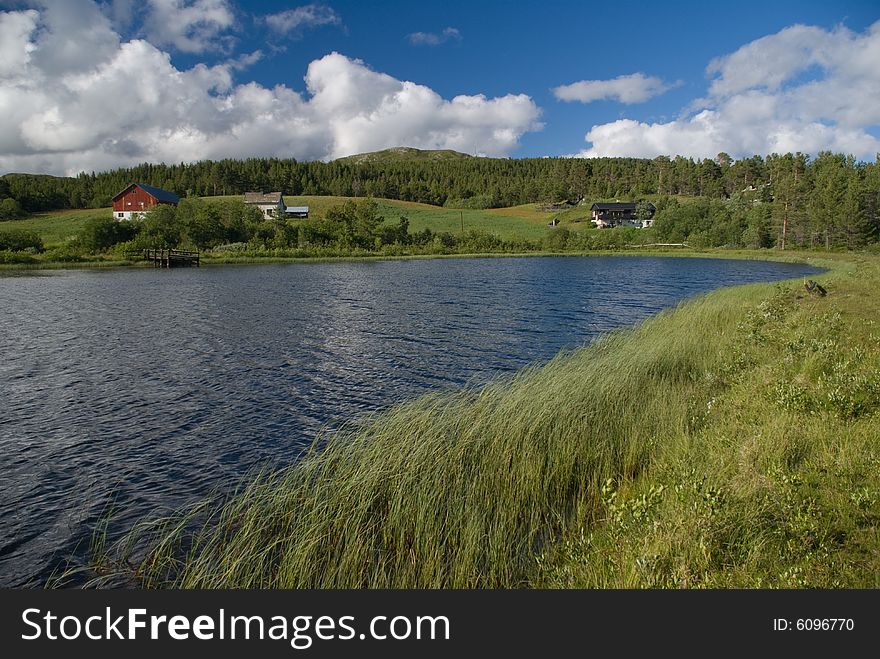 Norway landscape with typical cabin and lake. Norway landscape with typical cabin and lake