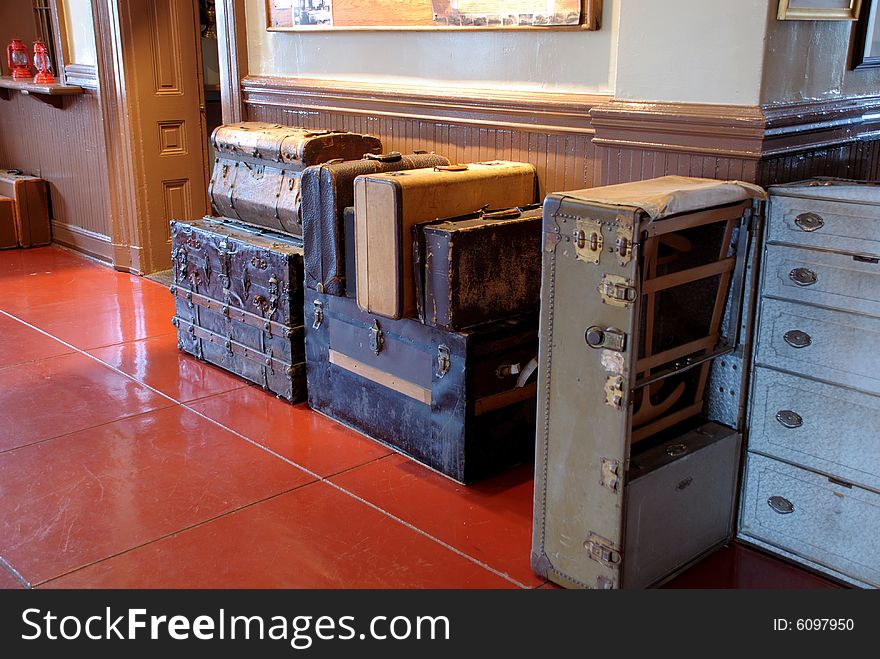 This is a shot of some old style luggage ready to go on a train ride. This is a shot of some old style luggage ready to go on a train ride.