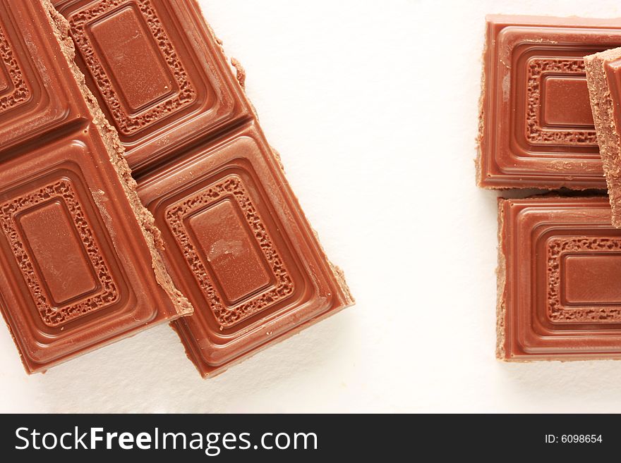 Milk chocolate isolated on white, shot in studio. Milk chocolate isolated on white, shot in studio